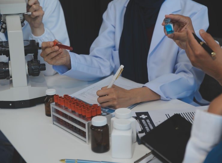 team-medical-staff-having-morning-meeting-boardroom-doctors-nurses-looking-digital-tablet_265022-90988